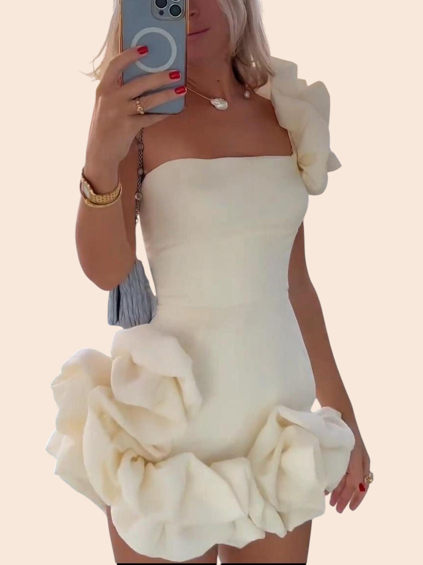My Store white one-shoulder mini dress featuring dramatic 3D floral accents on the shoulder and sculpted hem.