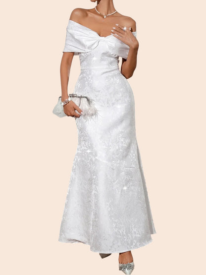 My Store white off-shoulder maxi dress featuring a statement bow bodice and elegant floral jacquard fabric