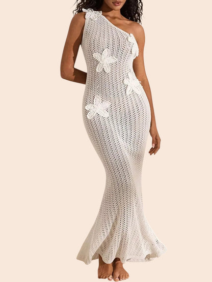 My Store white one-shoulder crochet maxi dress featuring dimensional floral appliqués and a flared hem on a model.