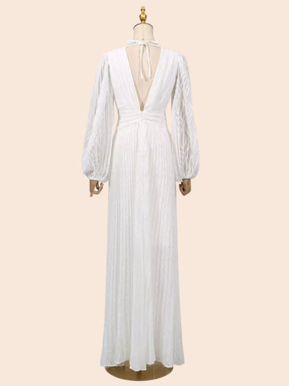 Back view of My Store white maxi dress with leaf texture, deep V-neck, tie closure, and voluminous balloon sleeves.