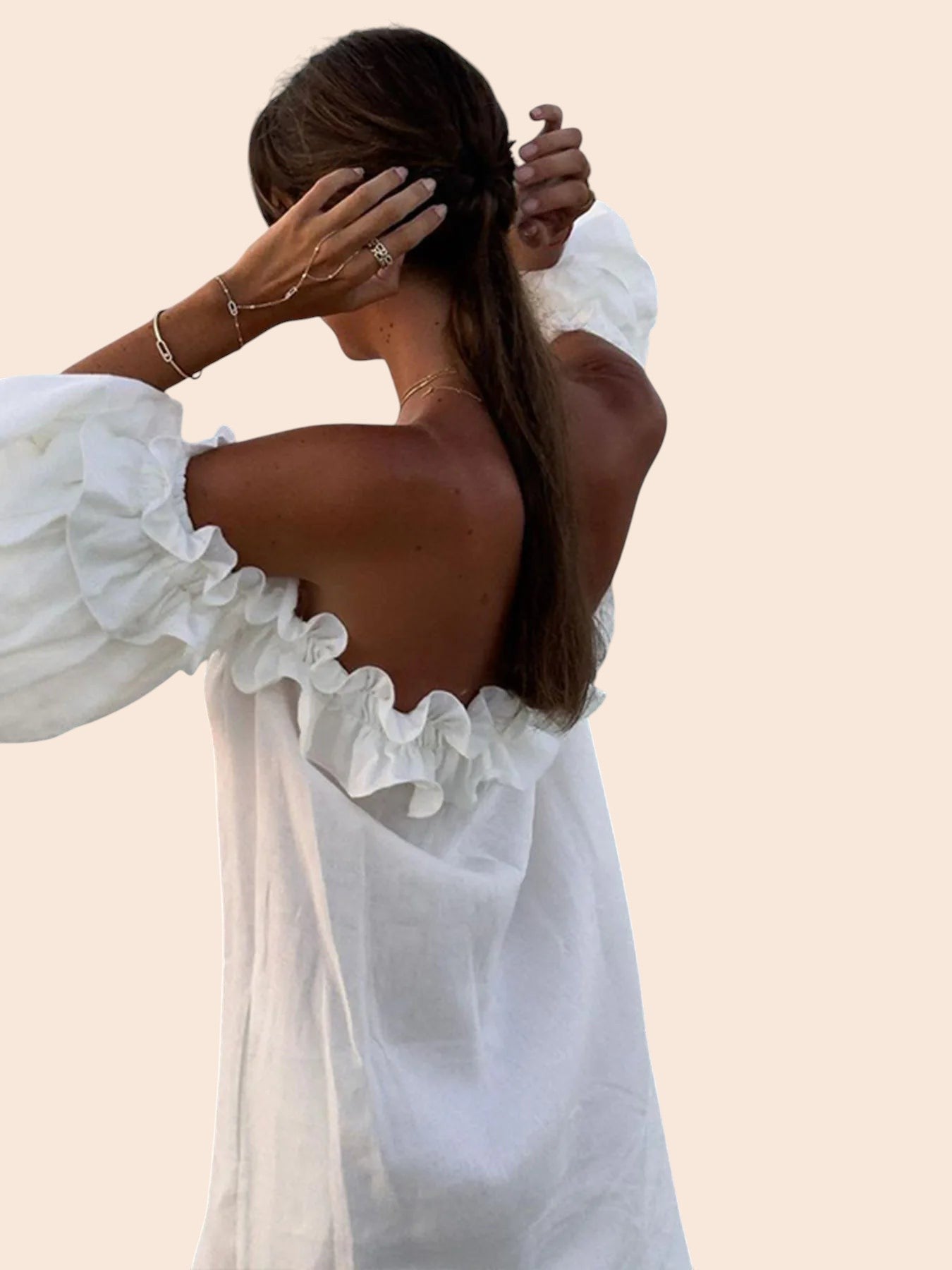 My Store white off-shoulder maxi dress with ruffled neckline and voluminous sleeves worn by a woman from behind