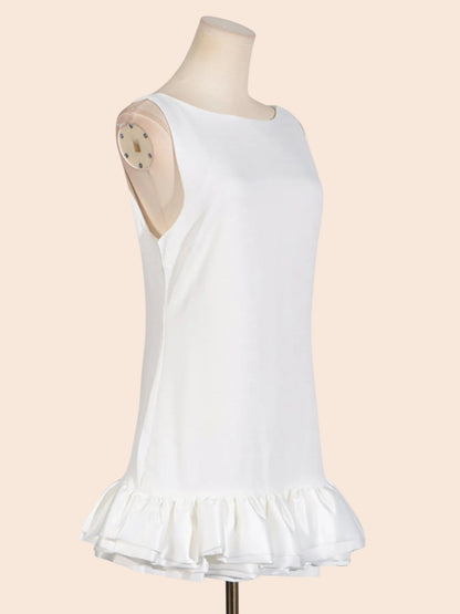 My Store white sleeveless mini dress with a round neckline and a sculpted layered ruffle hem on a mannequin