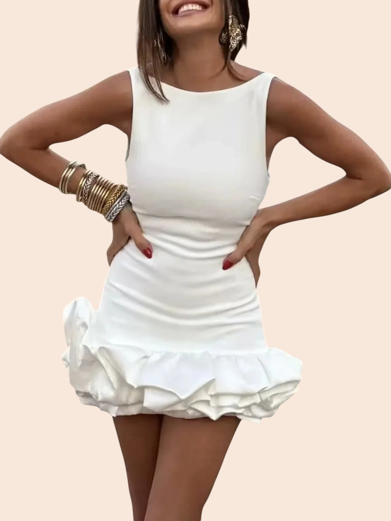My Store white sleeveless mini dress with a sculpted ruffle hem worn by a smiling woman with gold bangles
