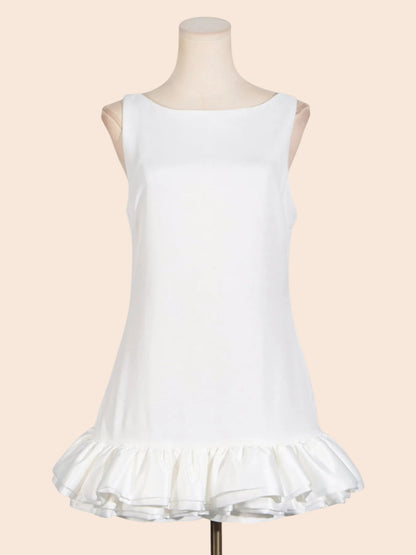 My Store white sleeveless mini dress with a round neckline and a sculpted layered ruffle hem on a mannequin