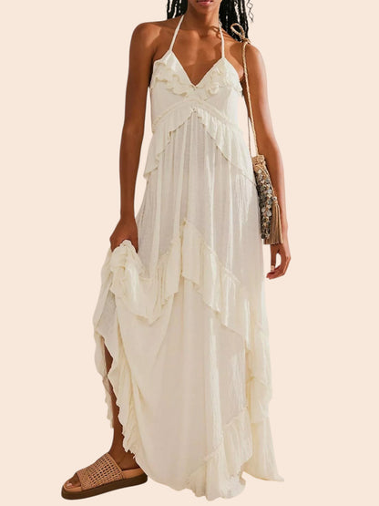 My Store white ruffled tiered halter maxi dress with an open back worn by a model with woven sandals
