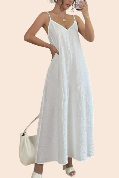 My Store white textured V-neck maxi dress with spaghetti straps worn by a woman holding a handbag