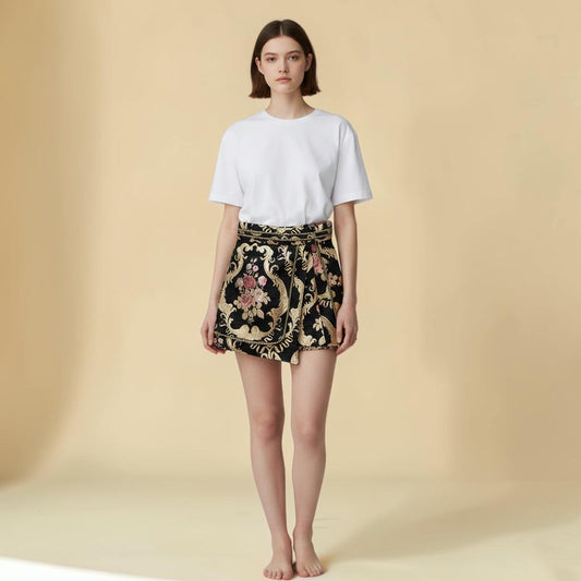 My Store black jacquard mini skirt with ornate gold scrollwork and pink floral embroidery, featuring a rope trim.